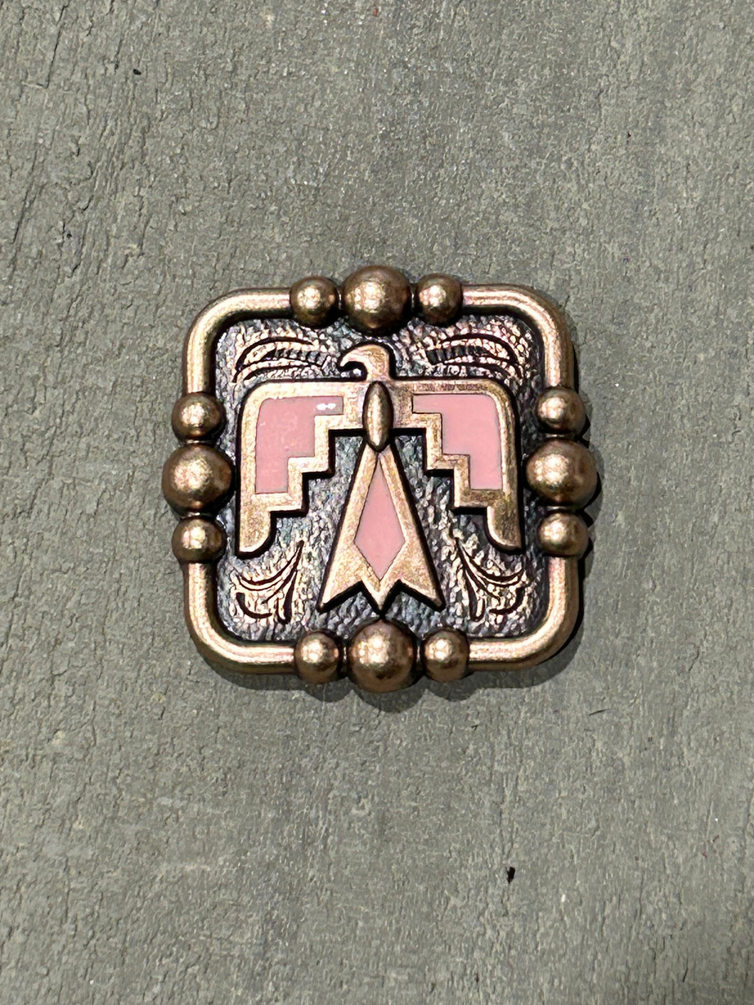 1.5” Copper Thunderbird Concho with pink color enamel