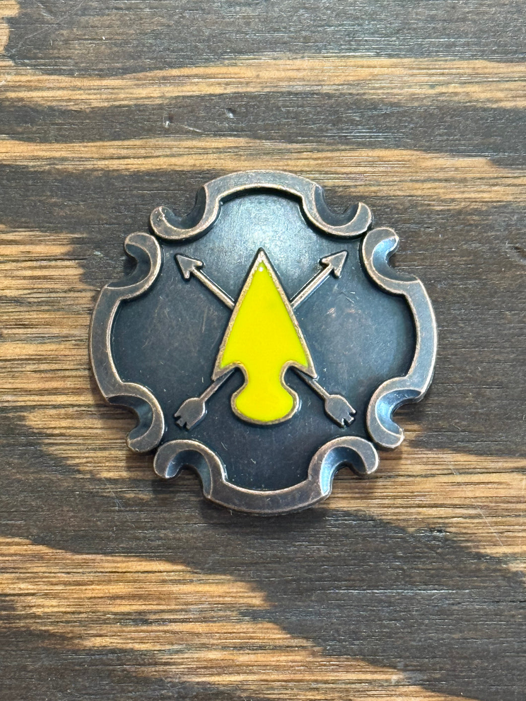 1.5” copper cross arrow concho with yellow enamel