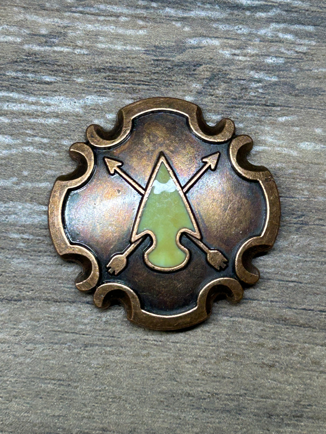 1.5” copper cross arrow concho with green enamel